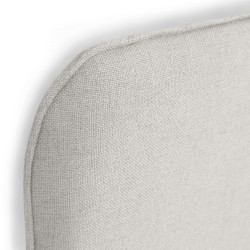 Detalle del cabecero tapizado en tejido Linetex, color Perla. Serie A