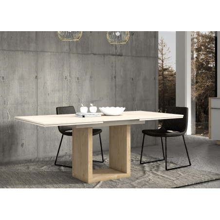Ambiente de comedor con mesa extensible con base central y sillas